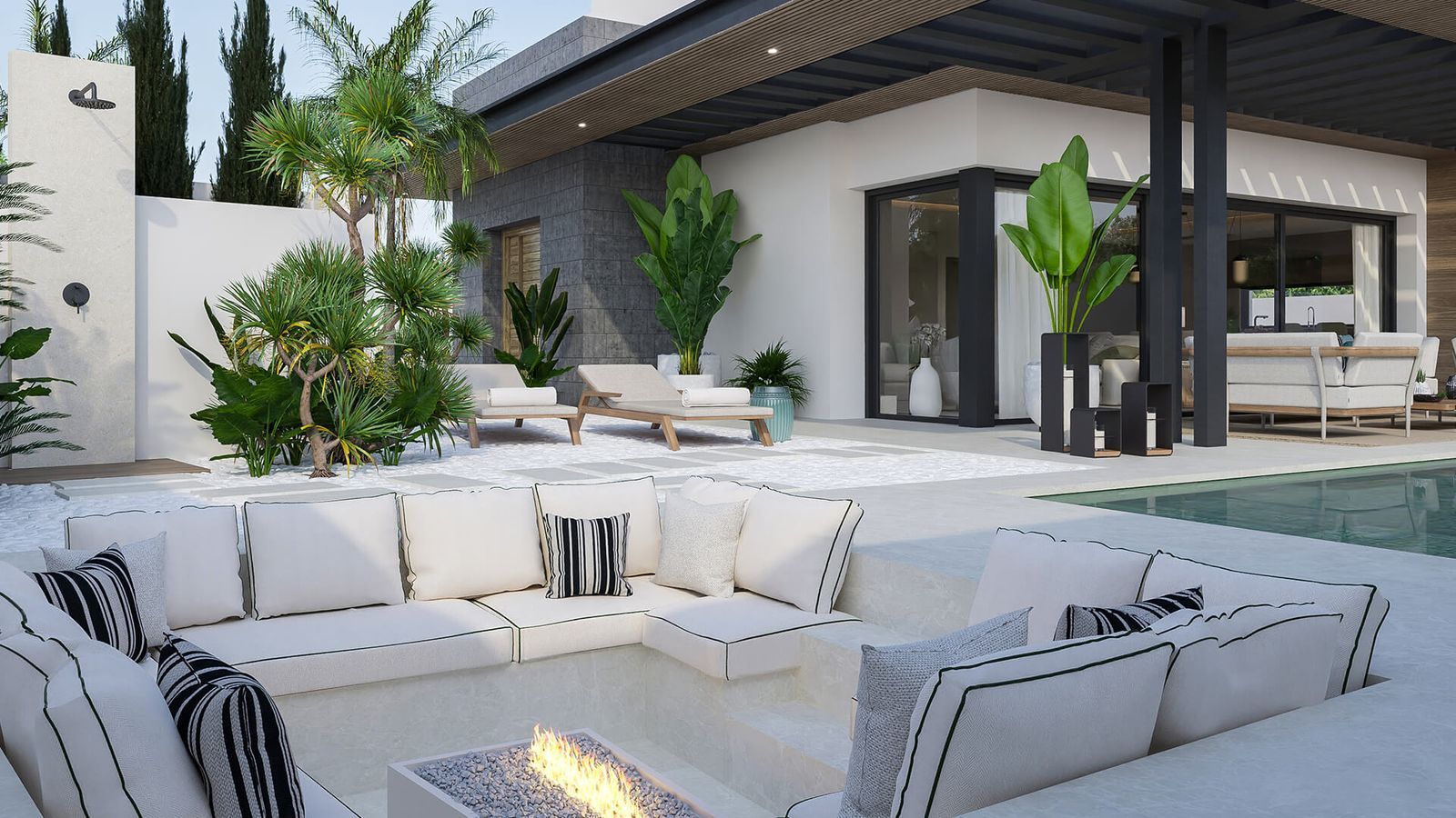 Luxe Bali villa buitenruimte met zwembad, zithoek, en ligstoelen.